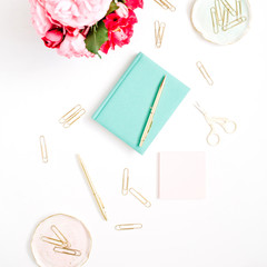 Flat lay home office desk. Female workspace pink and red roses bouquet, golden accessories, mint diary on white background. Top view feminine background.