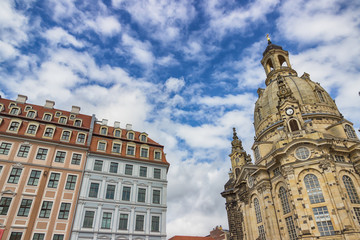 Famous Church Frauenkirche in Dresden against a beautiful sky with white clouds. Fragment. Saxony, Germany