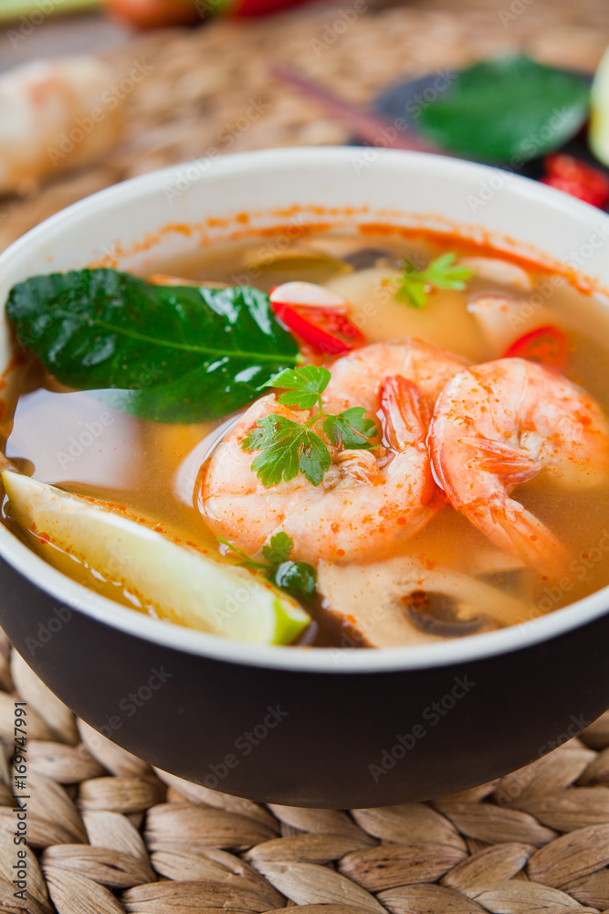 Wall mural thai cuisine pho soup with king prawns, lemon grass, lime, lime kaffir leaves tomato, galangal, chil