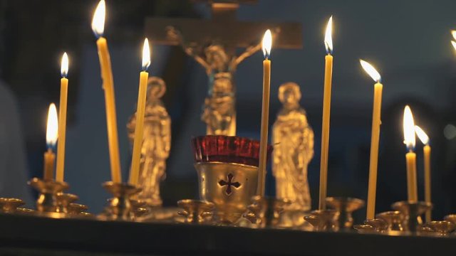 Religious traditions. Burning Church candles in the temple. Close up