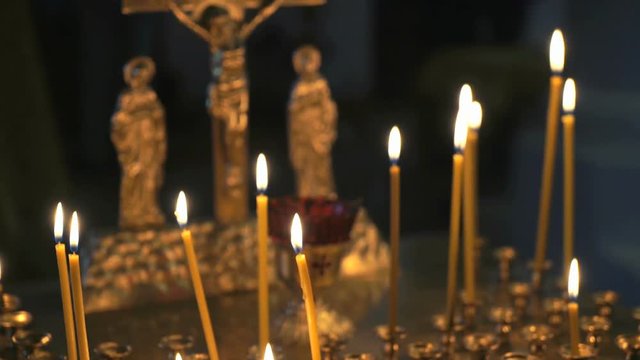 Religious traditions. Burning Church candles in the temple. Close up