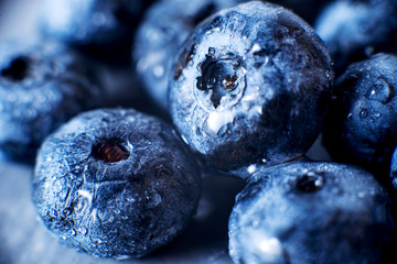 Contrast macro photo food, summer fresh juicy ripe berries, blueberries on gray background