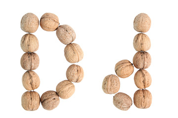 The group of walnuts on white background, making letter D. Studio shot