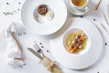 Grilled salmon on the white table flatlay background