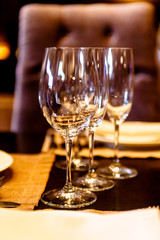 Empty wine glasses stand on a table in the restaurant.