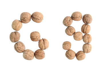 The group of walnuts on white background, making letter G. Studio shot