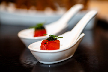 Cube raw tuna on a Japanese spoon for the soup was compliments of the chef