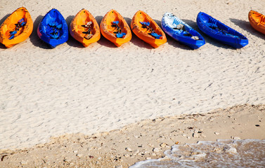colorful kayaks on the beach