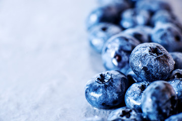 Contrast macro photo food, summer fresh juicy ripe berries, blueberries on gray background