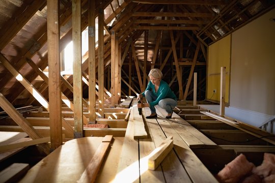 Senior woman doing carpentry work