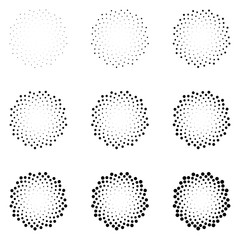 Halftone dotted circles isolated on the white background. Halftone effect vector pattern. Randomly distributed dots for your design.