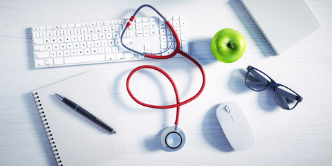 Fototapeta na wymiar Desktop beim Arzt mit Stethoskop und Apfel
