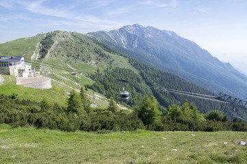 Fototapeta na wymiar 11 June, 2017, Modern high capacity cableway from Malcesine to mount Monte Baldo, Garda Mountains, Alps, Italy, Europe