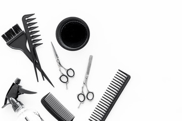 combs and hairdresser tools on white work desk background top view mockup