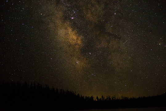Night photography of milky way galaxy stars over north America from Grand Tetons National Park