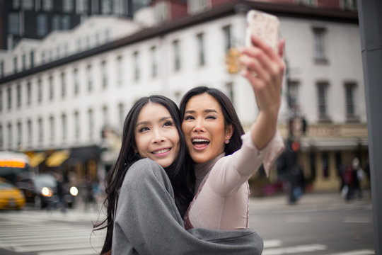Young asian girls taking selfie in Meatpacking district