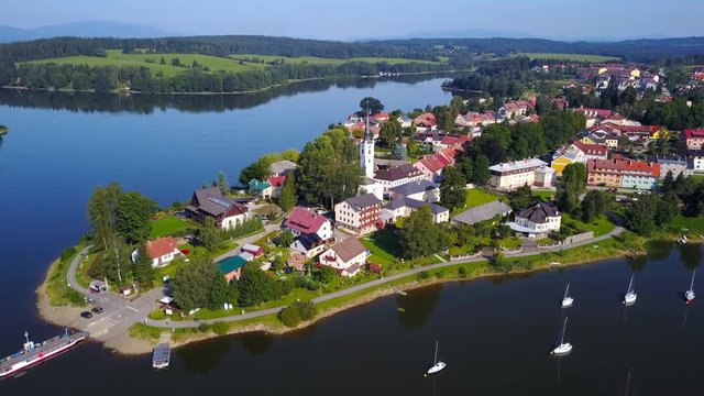 Aerial footage of the town of Frymburk including the Church of Saint Bartholomew, located in south bohemia, Czech Republic.