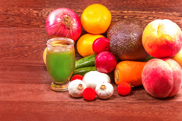 Fresh organic fruits in wicker basket on a grey wooden table wall background with copy space .