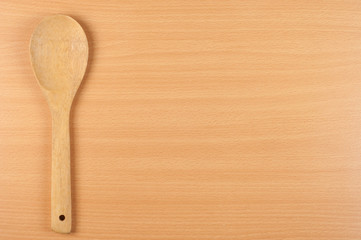 ladle on wooden table background, with copy space 