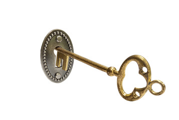 Gold key on white