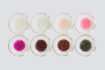 Pink, white and black seed beads displayed in glass bowls
