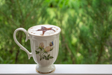 hot chocolate with green bokeh background , vintage and retro style
