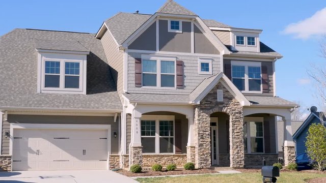 Wide establishing shot of a typical middle class home in subdivision