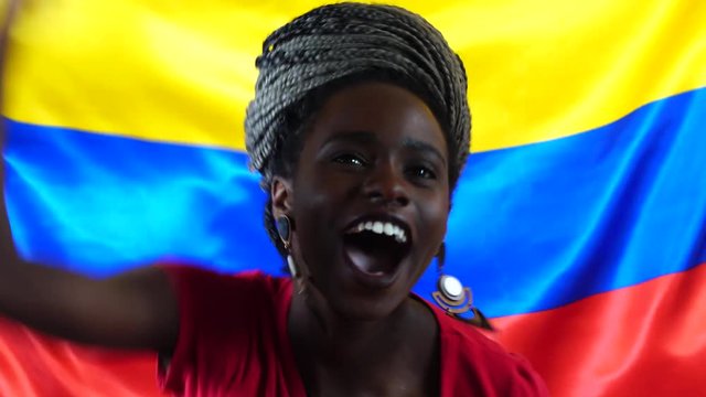Colombian Young Black Woman Celebrating with Colombia Flag