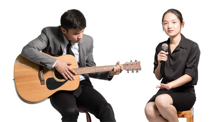 Portrait of a young business man with guitar and business woman with microphone. Office party concept. Isolated on white background with clipping path