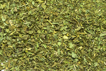 Dried shredded green leaves tea, mint, tobacco