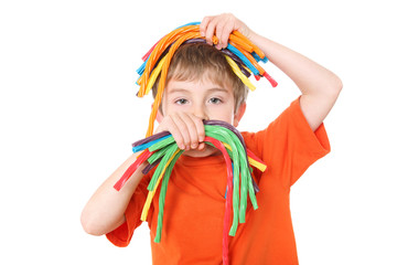 Young boy holding colorful licorice candy