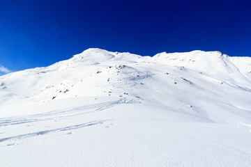 Mountain panorama with snow and ski tracks in winter in Stubai Alps, Austria