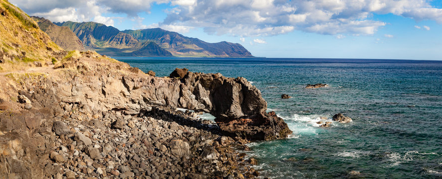 Panorama coastal landscape and seascape of Kaena Point National Park on Oahu, Hawaii north shore with rocky arch. / Kaena Point Panorama Landscape