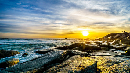 Sunset over the horizon of the Atlantic Ocean at Camps Bay near Cape Town South Africa on a nice winter day