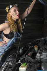 Fototapeta na wymiar mechanic girl repairs