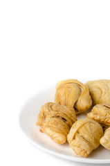 Curry puff on white dish with copyspace