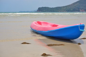 Colorful kayak on the beach.