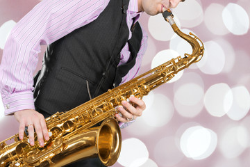 Fototapeta na wymiar Jazz saxophone player in performance on the stage.