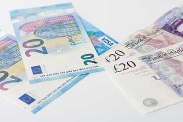 Visa card, british pounds and euro on white background