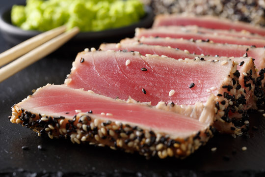beautiful food: sliced tuna steak with sesame macro. horizontal
