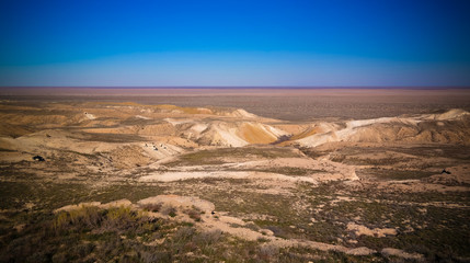 Fototapeta na wymiar Panorama view to Aral sea from the rim of Plateau Ustyurt at sunset in Karakalpakstan, Uzbekistan