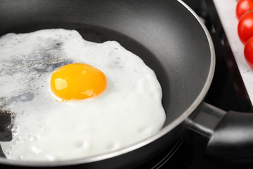 Cooking of delicious sunny side up egg, closeup