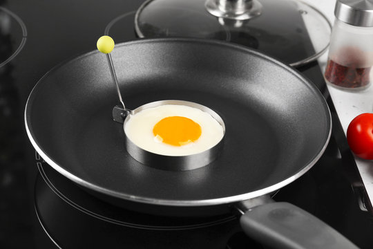 Cooking of delicious sunny side up egg, closeup