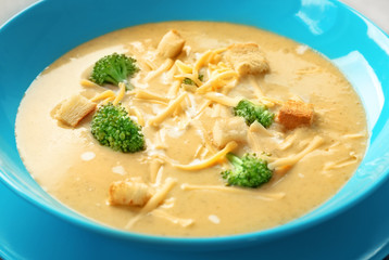 Plate with broccoli cheddar soup, close up