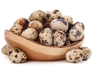 Obraz premium quail eggs in wooden bowl isolated on white background cutout