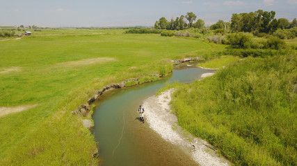 Fototapeta na wymiar Aerial view of fly fisherman fishing in Montana river