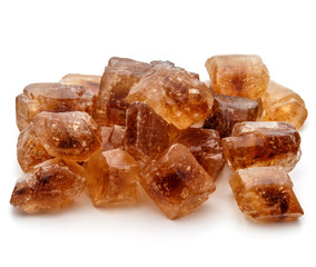 Brown caramelized lump cane sugar cube isolated on white background cutout