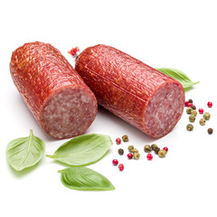 Salami smoked sausage, basil leaves and peppercorns isolated on white background cutout