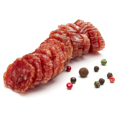 Salami smoked sausage slices and peppercorns isolated on white background cutout