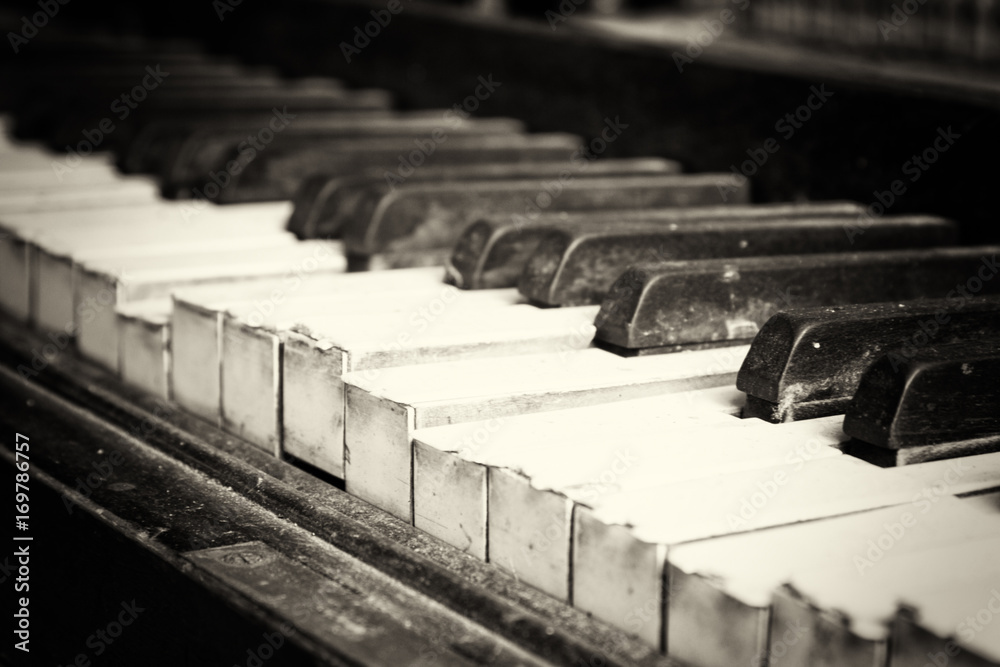 Wall mural Keys from an old broken damaged piano